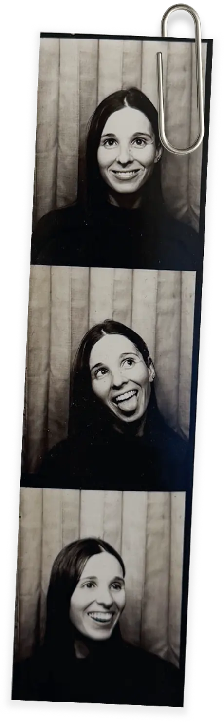 Photo booth strip of Sofia smiling, pinned with a paperclip